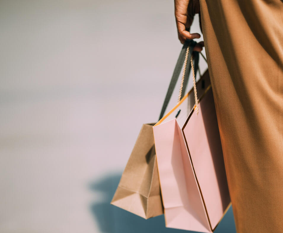 person holding carrier bags